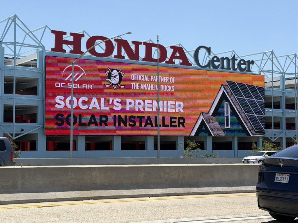 OC SOLAR on the Honda Center LED marquee along the 57 Freeway