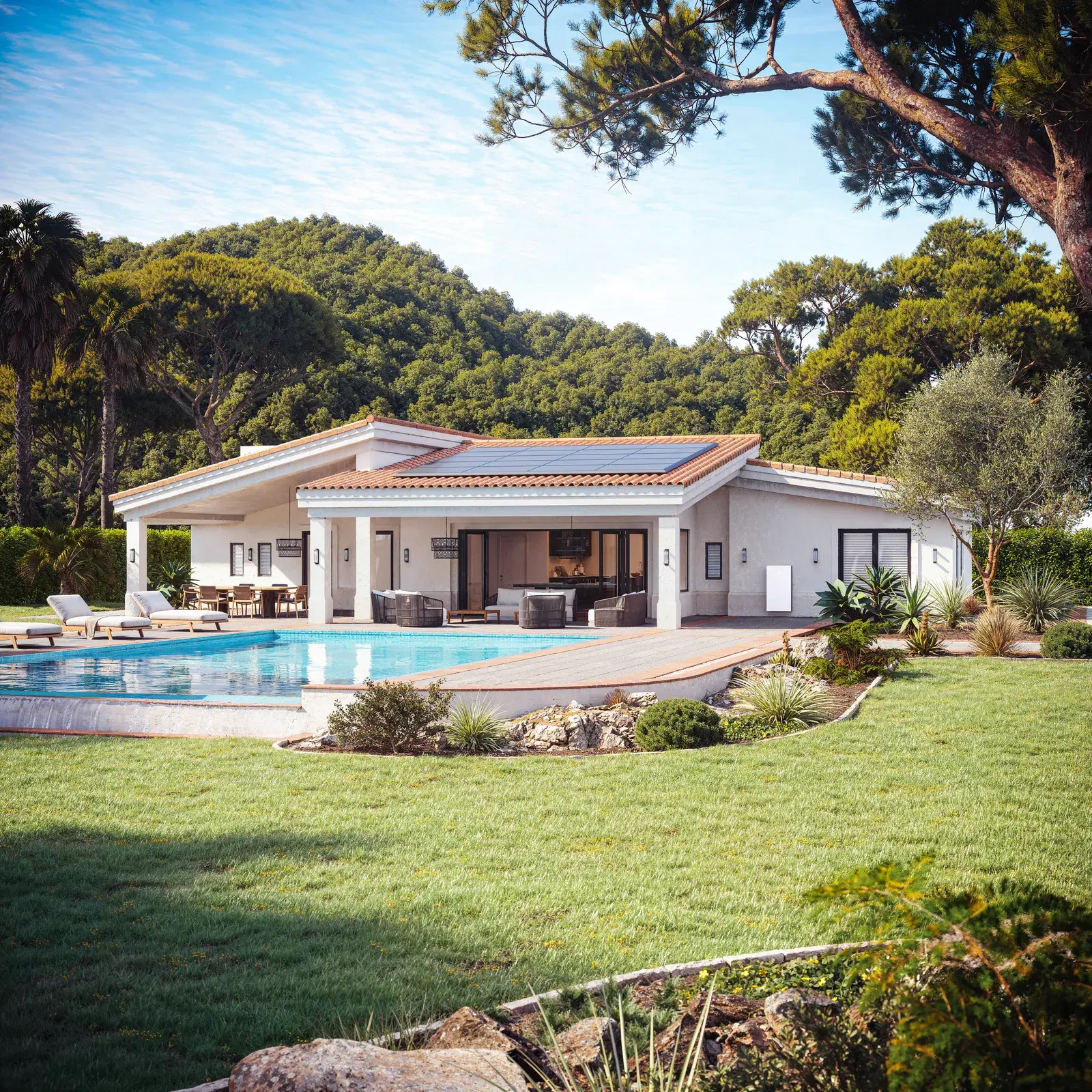 Single-story luxury home with a swimming pool, rooftop solar panels on a terracotta roof, and a white Tesla Powerwall on the exterior wall.