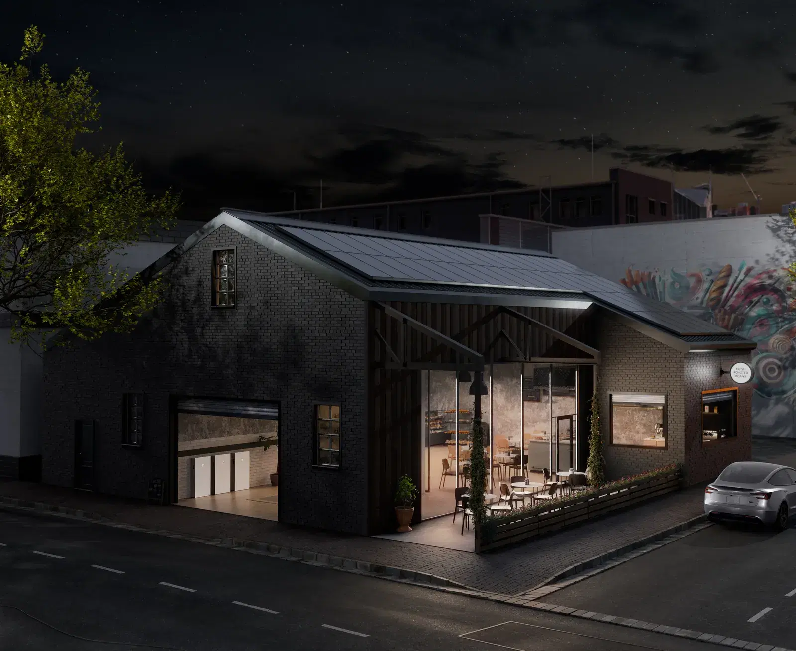 Nighttime view of a black-brick cafe with a smooth glass solar-tile roof, glowing interior, white batteries in an open garage, and a car parked alongside.