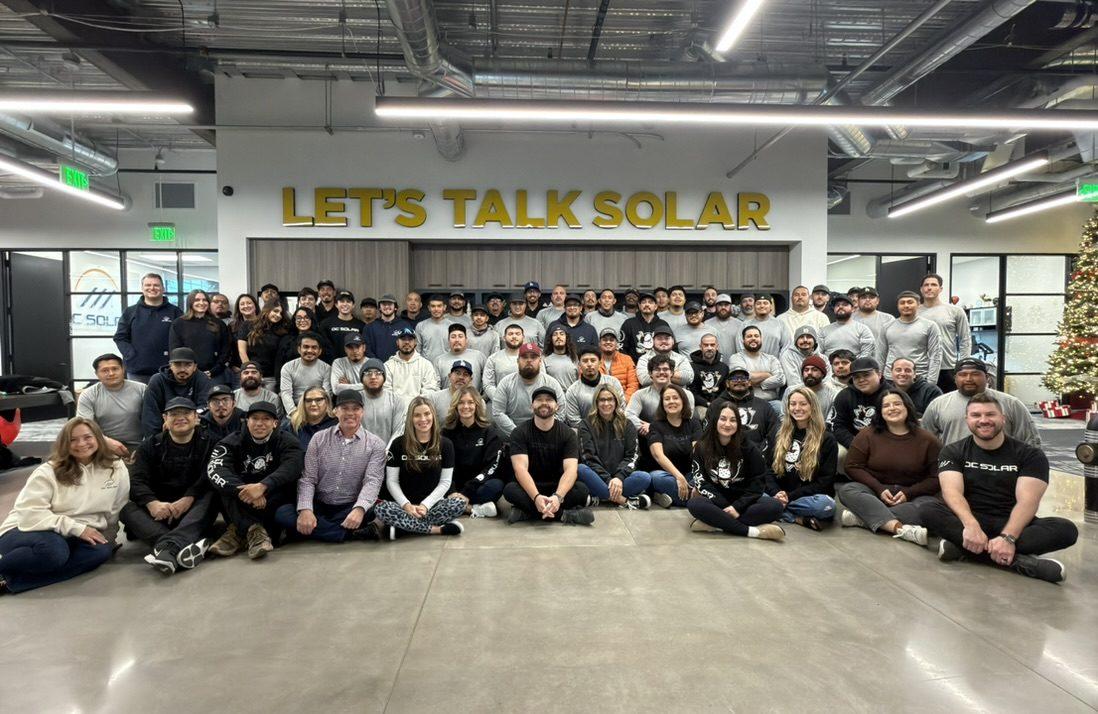 Group photo of the OC Solar team gathered together at the company headquarters