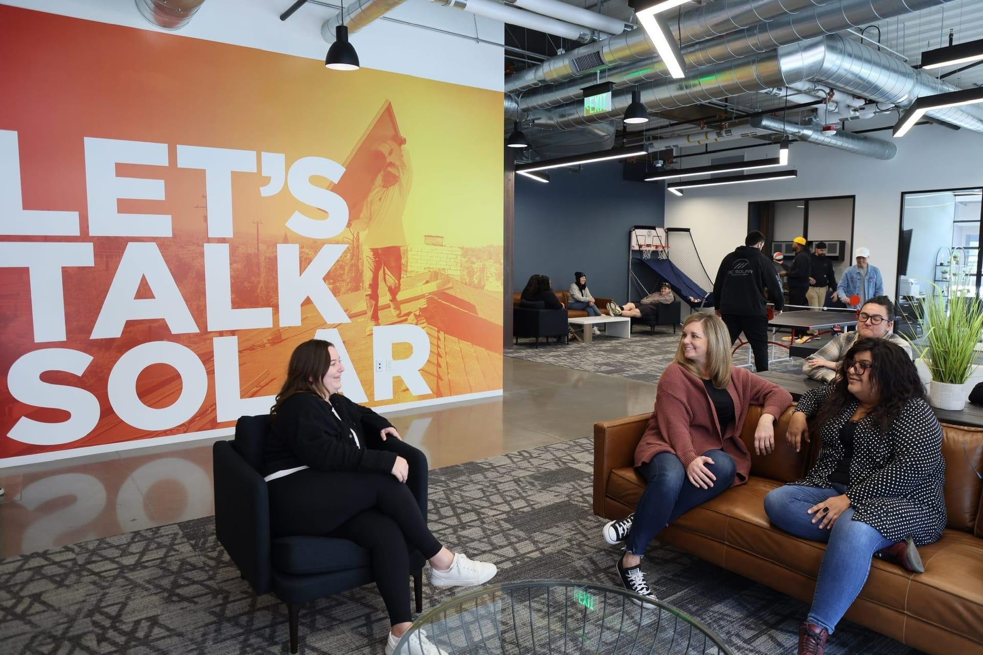 Inside OC Solar · The office mural wall