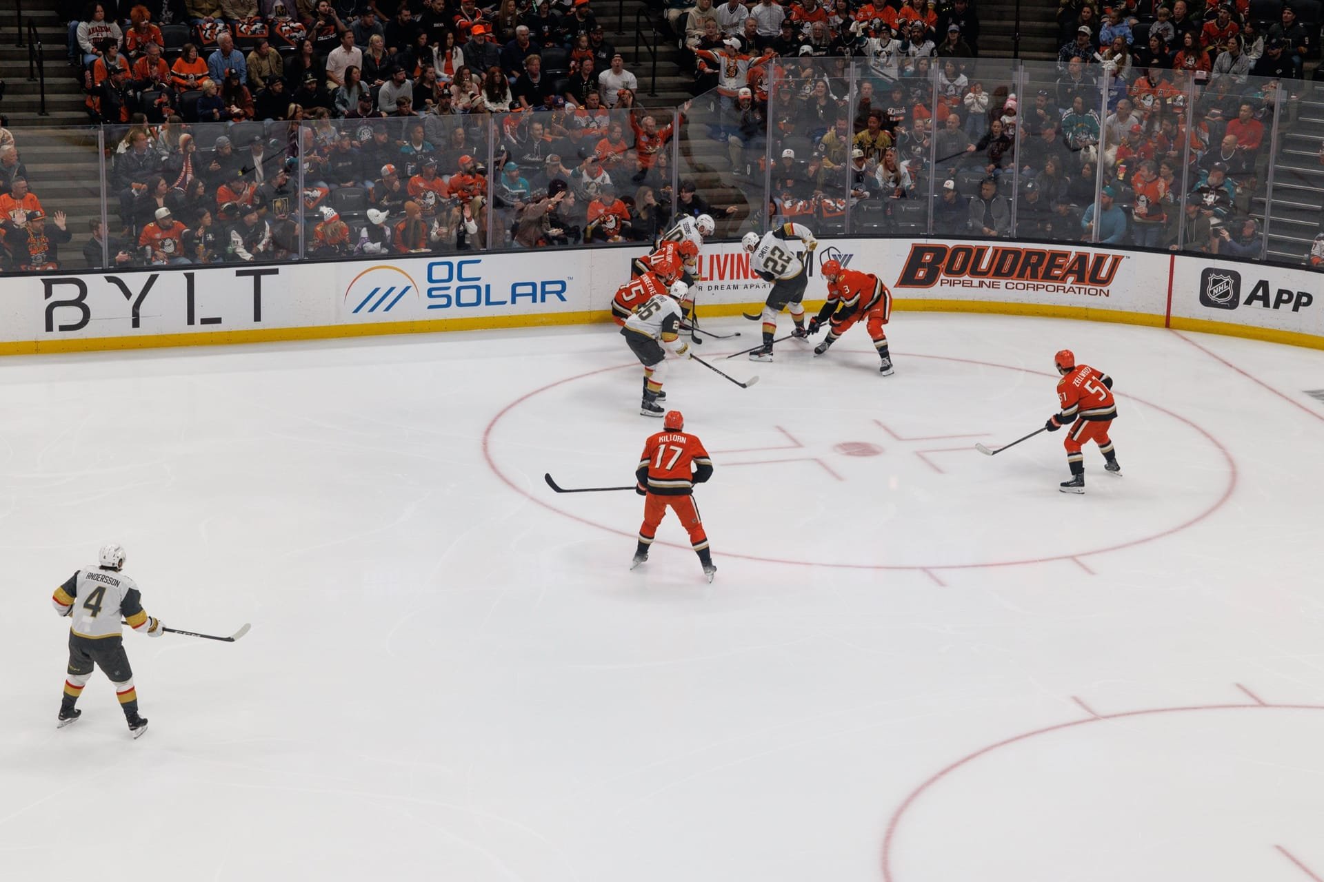 OC Solar logo on the rink-side dasher boards during a live Anaheim Ducks game at Honda Center
