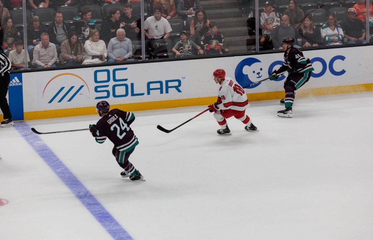 OC Solar logo on the Anaheim Ducks dasher boards at Honda Center