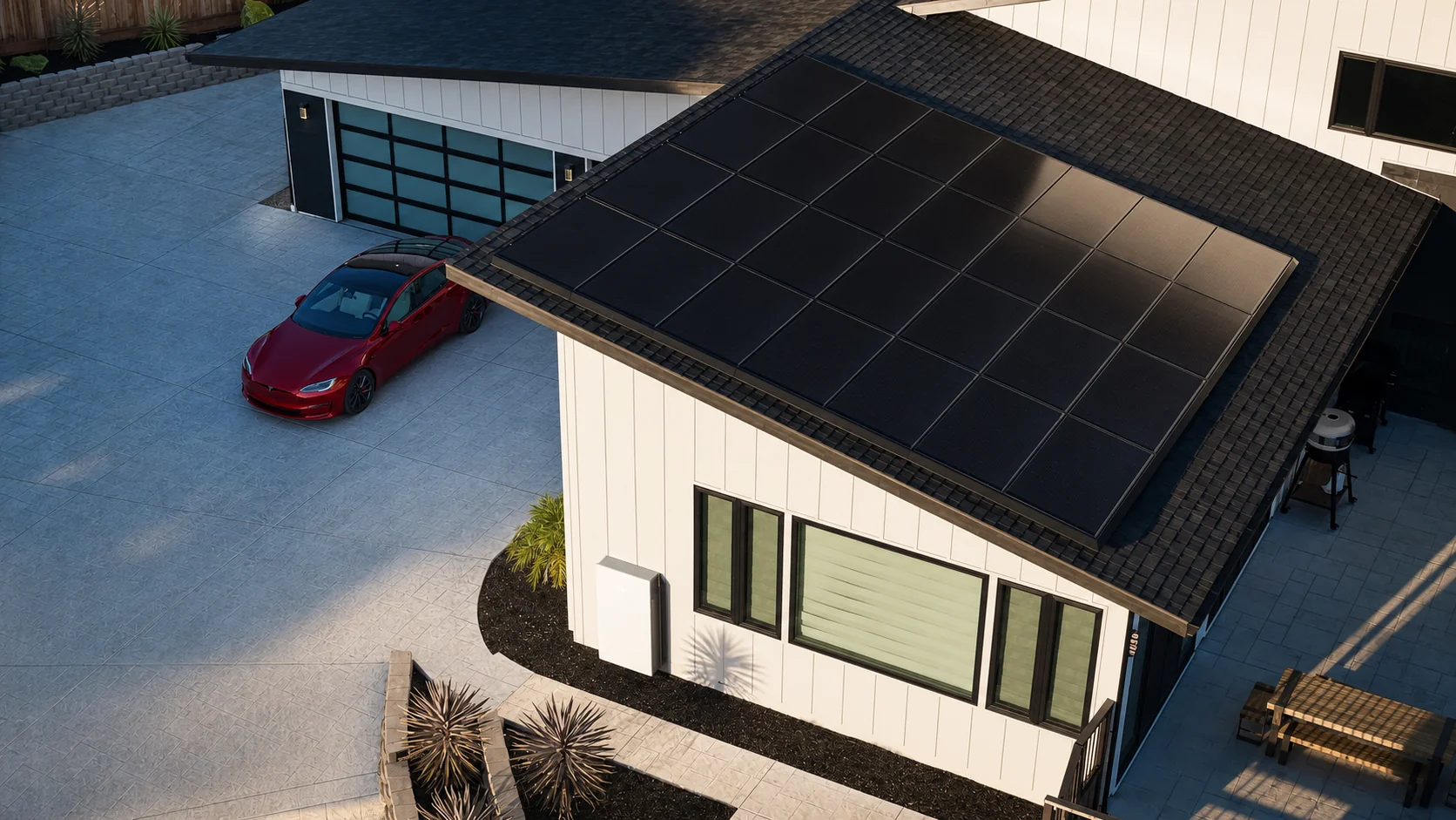 Aerial view of all-black solar panels filling a home's roof, with an electric car in the driveway