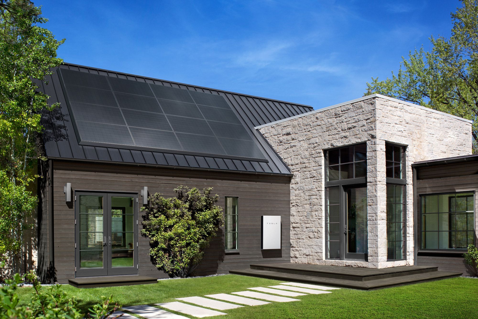 Modern house with solar panels on slanted roof